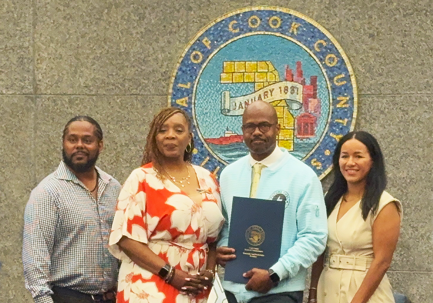 The Honorable Cook County Commissioner Dr. Kisha McCaskill presenting SELOC with a Resolution of the Board of Commissioners Cook County Illinois